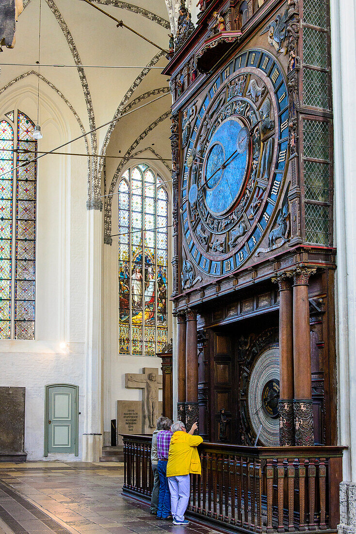 Tourists in front of Astronomical Clock in the Marien Kirche, Rostock, Ostseekueste, Mecklenburg-Vorpommern Germany