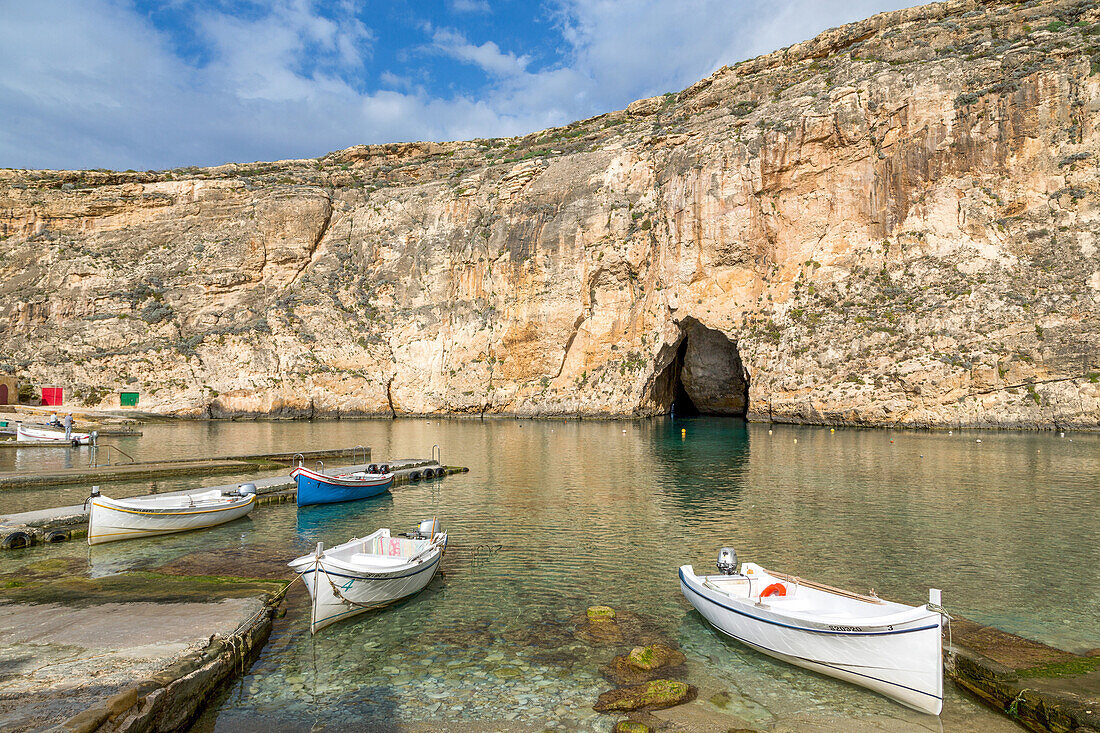 Traditional boats in the harbour at Dwejra Inland Sea in Gozo, Malta, Mediterranean, Europe