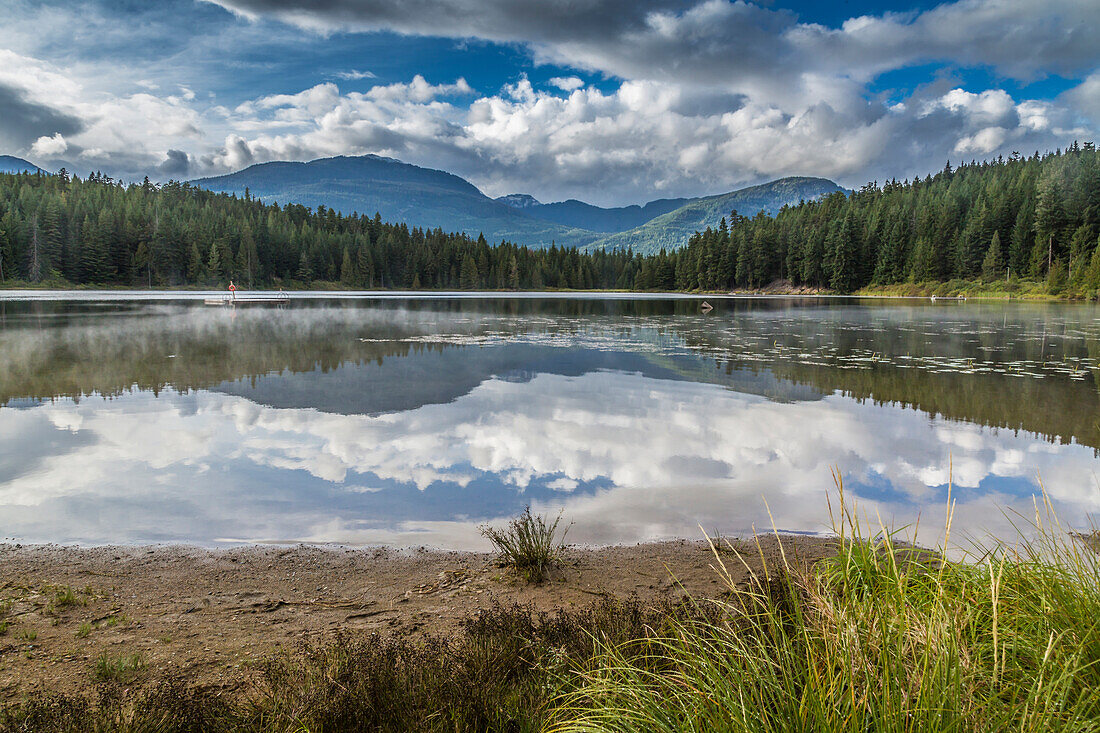 Mist on Lost Lake, Ski Hill and surrounding forest, Whistler, British Columbia, Canada, North America