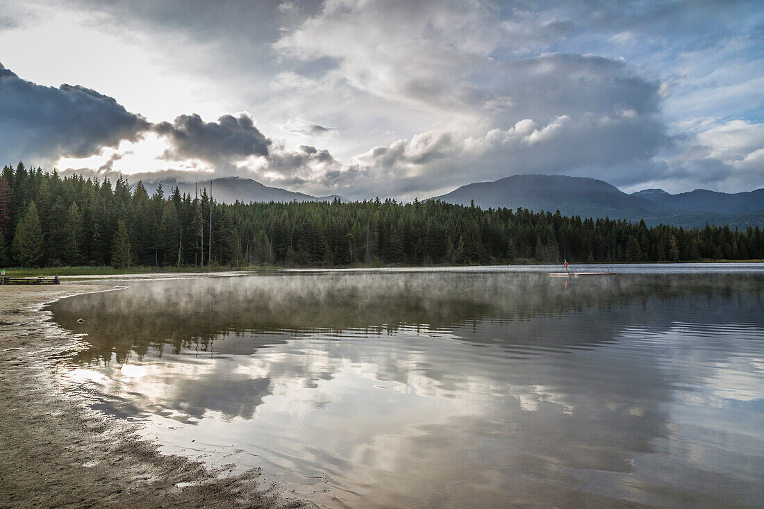 Mist on Lost Lake, Ski Hill and surrounding forest, Whistler, British Columbia, Canada, North America