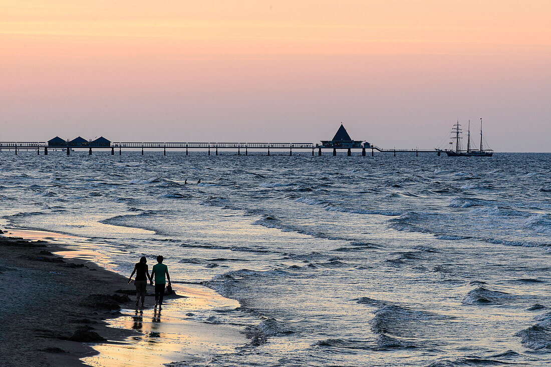 People are walking on the beach. View from the Ahlbecker beach on the sea bridge of Heringsdorf, Ahlbeck, Usedom, Baltic Sea coast, Mecklenburg-Western Pomerania, Germany