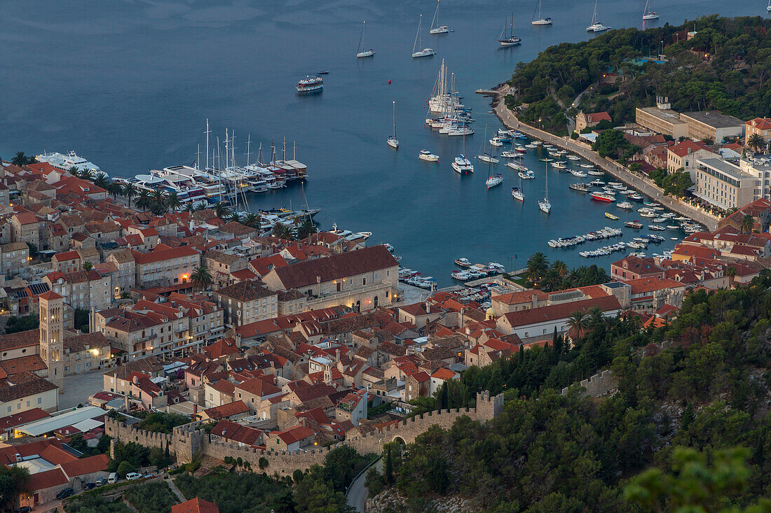 High-angle view over the port and the old town of Hvar Town at dawn, Croatia, Europe