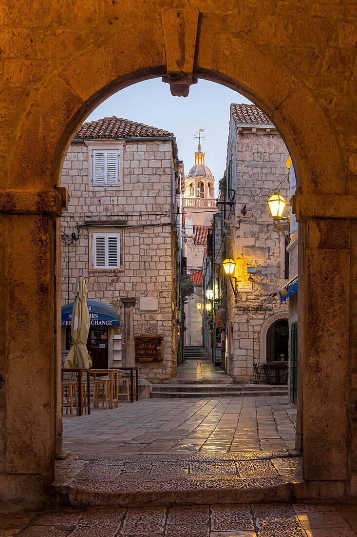 View from the town gate of the old town of Korcula to the cathedral at dawn, Korcula, Croatia, Europe