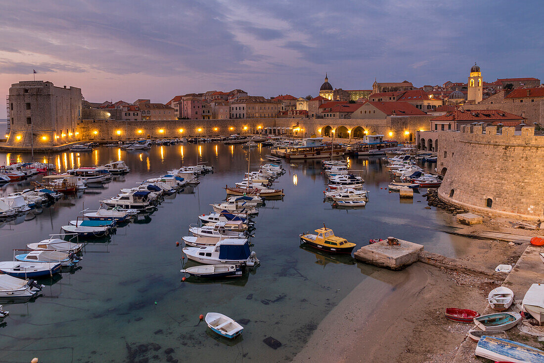 Elevated view over the port and the old town at dawn, UNESCO World Heritage Site, Dubrovnik, Croatia, Europe