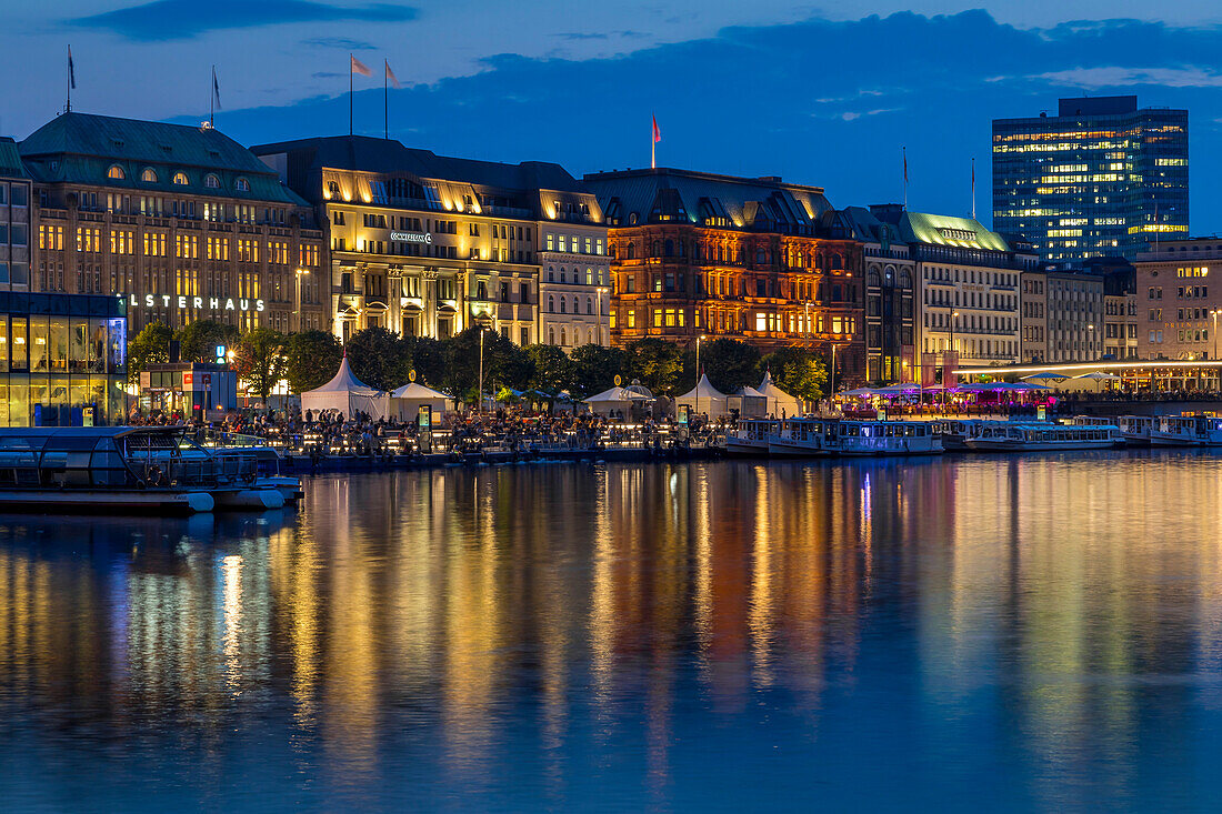 Illuminated buildings at Jungfernstieg and the Inner Alster at dusk, Hamburg, Germany, Europe