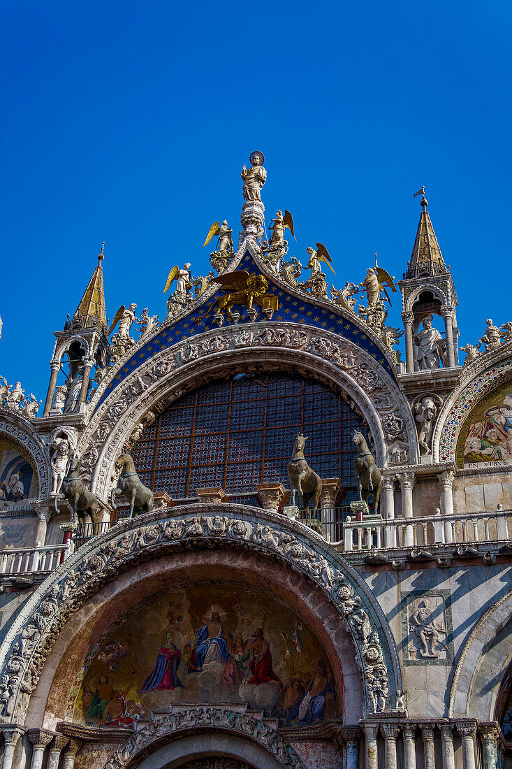 External day view detail of the gable of The Patriarchal Cathedral Basilica of Saint Mark at Piazza San Marco, Venice, UNESCO World Heritage Site, Veneto, Italy, Europe