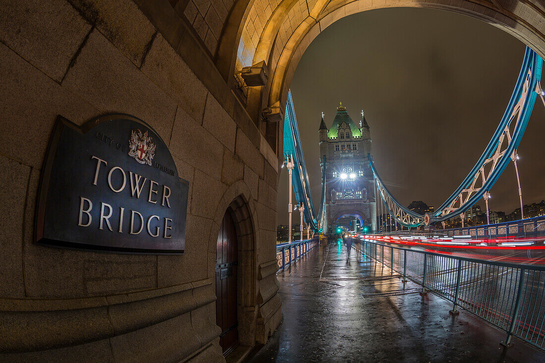 Fisheye view of traffic trail lights on Tower Bridge at night, Southwark, London, England, United Kingdom, Europe