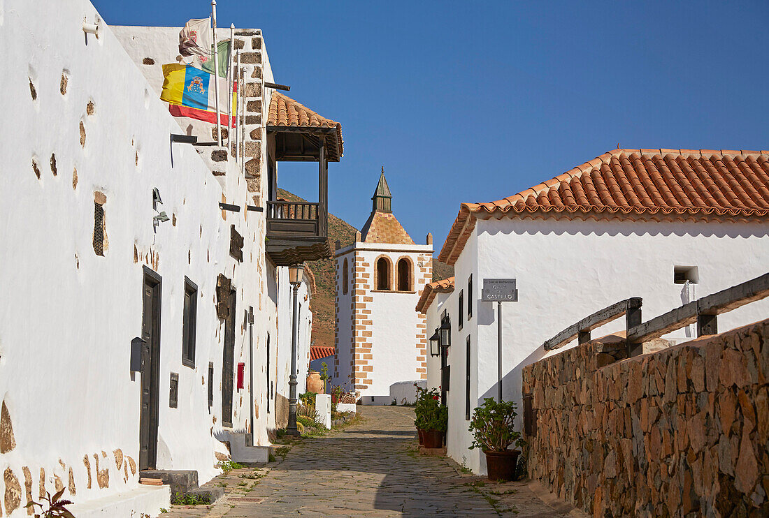 Street with church tower of church Iglesia de Santa María at Betancuria, Fuerteventura, Canary Islands, Islas Canarias, Atlantic Ocean, Spain, Europe