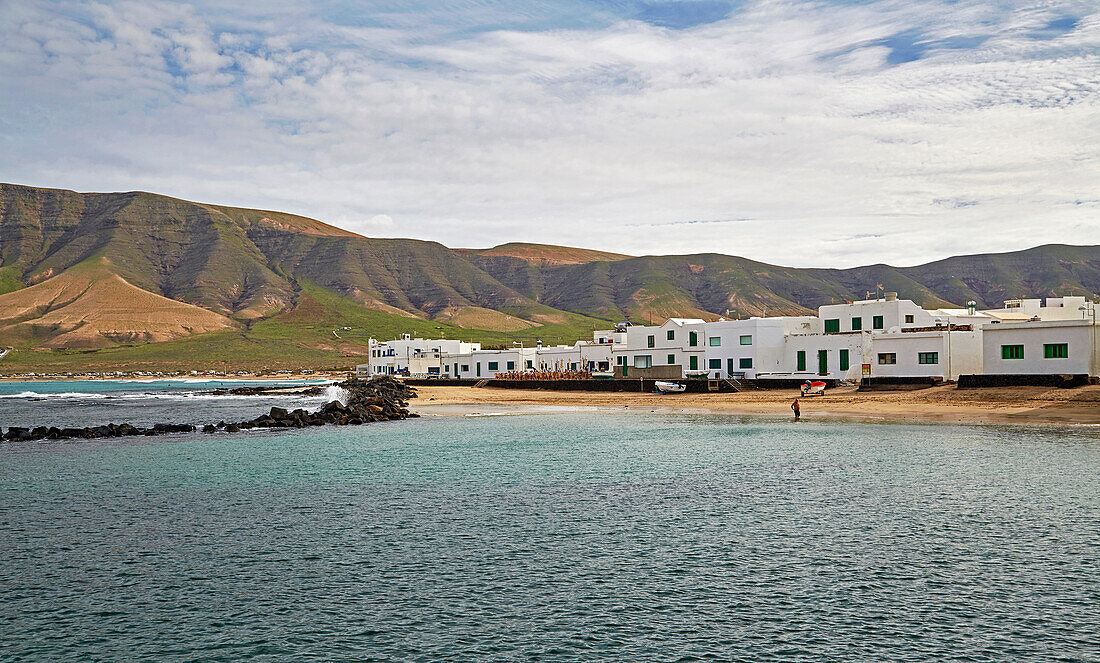 Village of La Caleta de Famara at the foot of the Famara Mountains, Atlantic Ocean, Lanzarote, Canary Islands, Islas Canarias, Spain, Europe