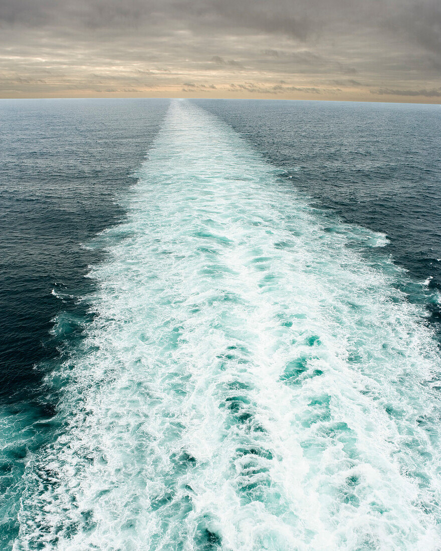 Wake of a cruise ship at sea in Alaska, USA.