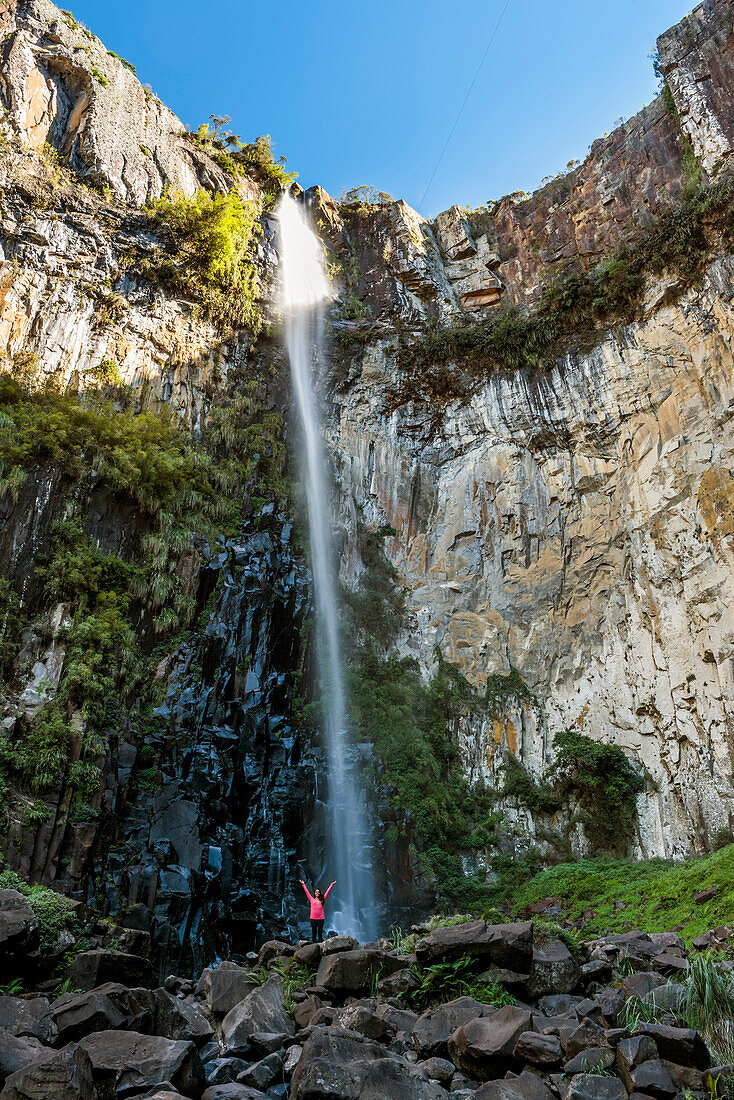 Young woman by Avencal Waterfall, Urubici, Santa Catarina State, Brazil