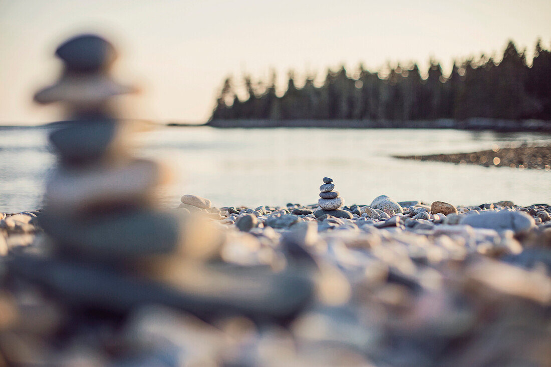 Cairn stones on rocky beach, Acadia National Park, Maine, USA