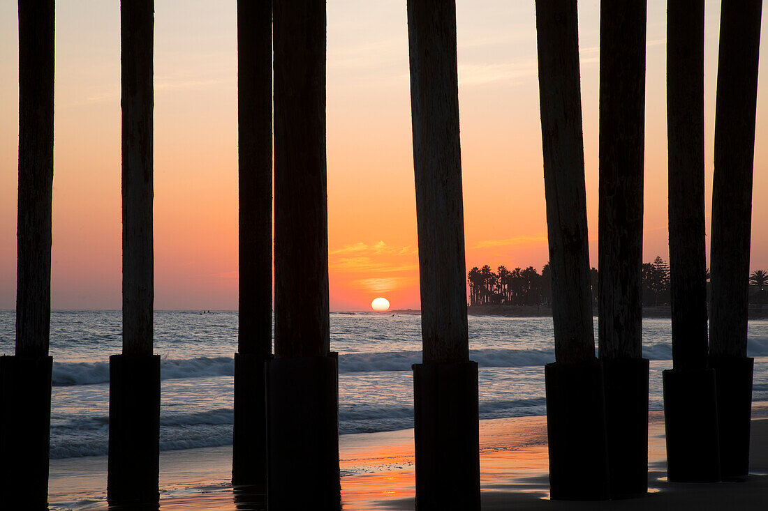 Silhouette of pier stumps at Ventura Beach pier, Ventura, California, USA