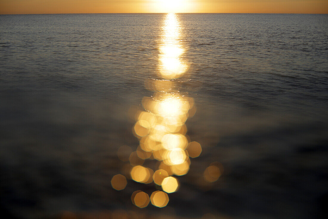 Sunlight reflecting on sea surface at sunset, Murcia, Spain