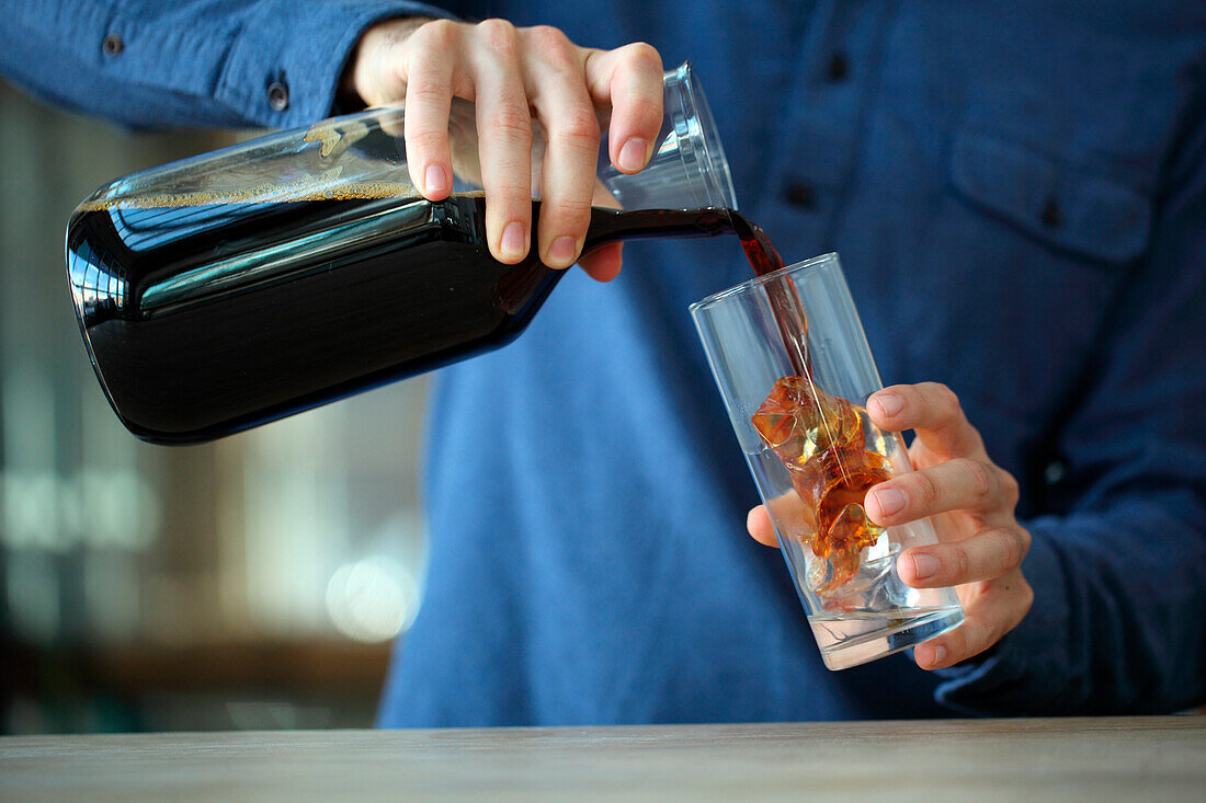 Barista making iced coffee, Kenwood, California, USA