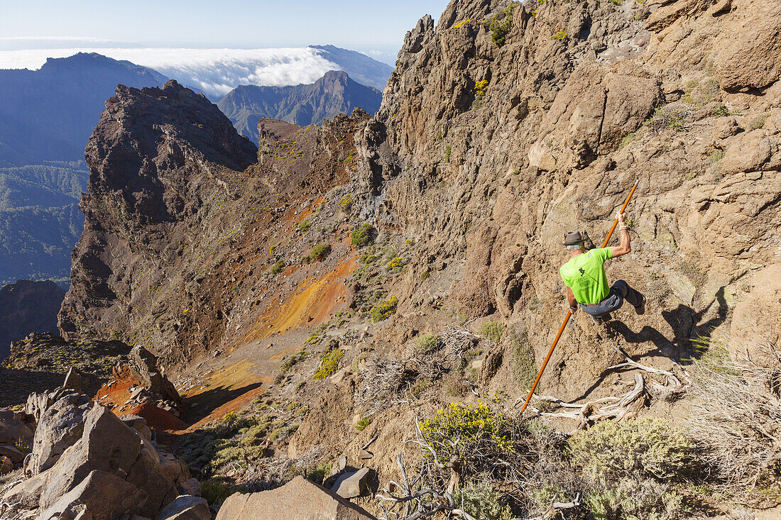 man jumping with the canarian crook, Salto del Pastor Canario, crater rim, Caldera de Taburiente, UNESCO Biosphere Reserve, La Palma, Canary Islands, Spain, Europe