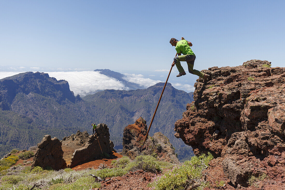 man jumping with the canarian crook, Salto del Pastor Canario, crater rim, Caldera de Taburiente, UNESCO Biosphere Reserve, La Palma, Canary Islands, Spain, Europe