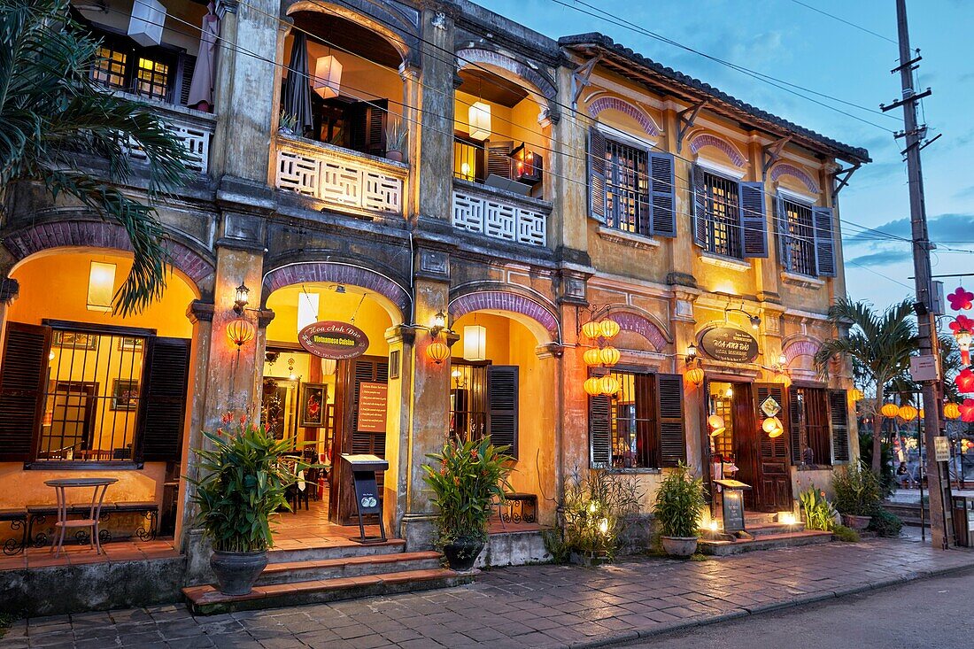 Building in Hoi An Ancient Town illuminated at dusk. Hoi An, Quang Nam Province, Vietnam.
