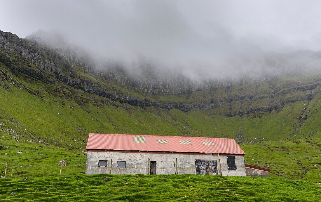 Sheep shelter on Kalsoy. Nordoyggjar (Northern Isles) in the Faroe Islands, an archipelago in the north atlantic. Europe, Northern Europe, Scandinavia, Denmark, Faroe Islands.