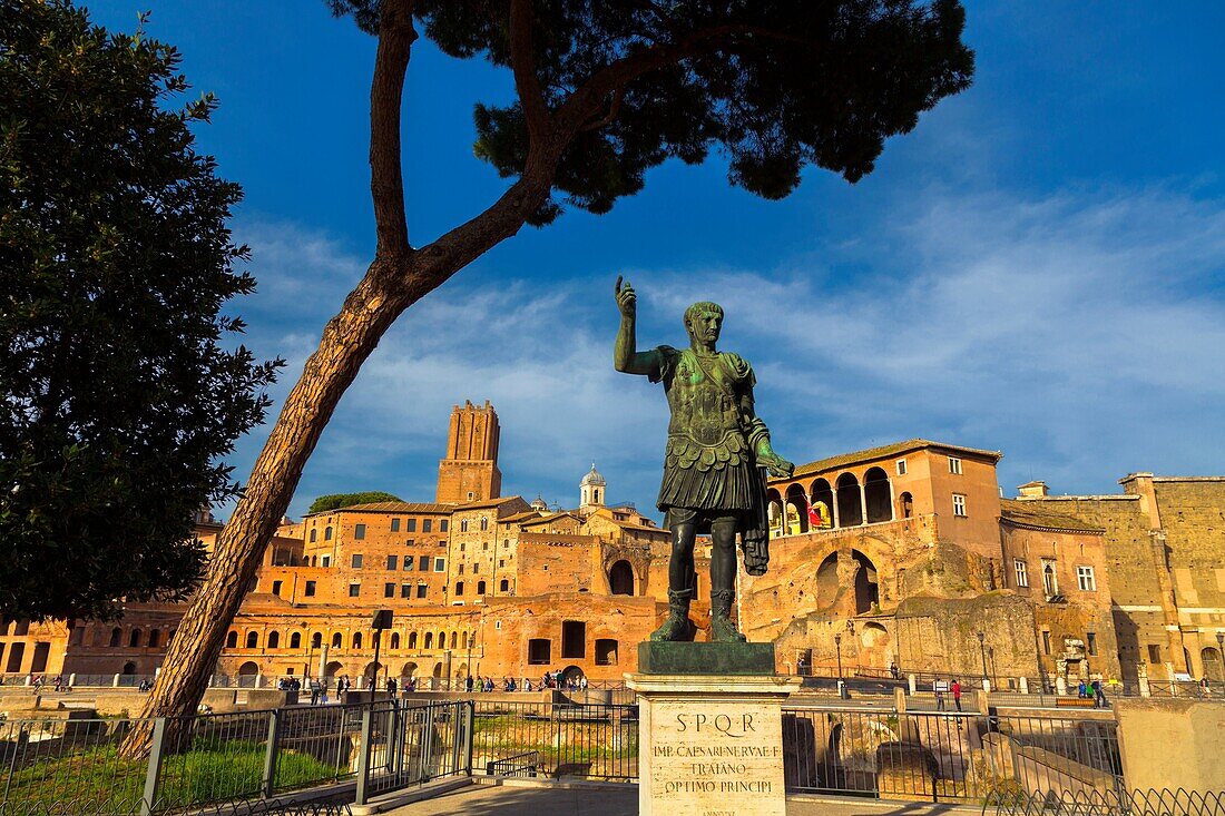 Rome, Italy. Statue of the Emperor Trajan with Trajan's Forum behind. The Historic Centre of Rome is a UNESCO World Heritage Site.