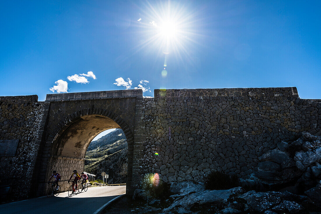 Cyclists on the famous winding road leading to Torrent de Pareis, Sa Calobra, Tramuntana Mountains, Mallorca, Spain