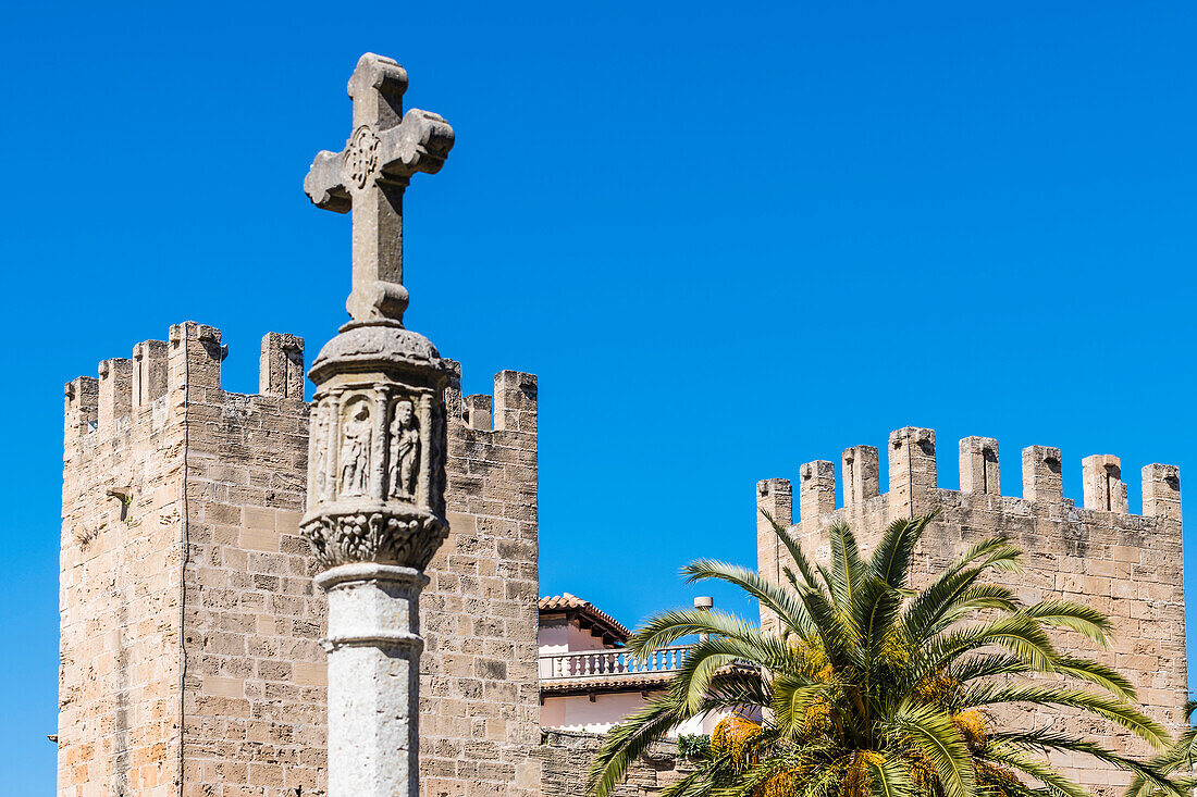 City gate with column and stone cross, Mallorca, Spain