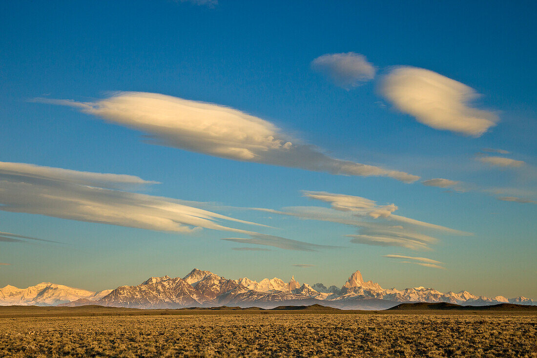 Lenticular and cumulus clouds above peaks, Fitzroy Massif, Los Glaciares National Park, Patagonia, Argentina