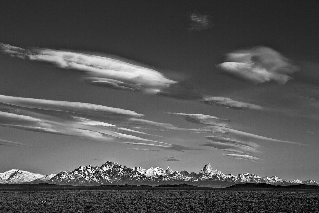 Lenticular and cumulus clouds above peaks, Fitzroy Massif, Los Glaciares National Park, Patagonia, Argentina