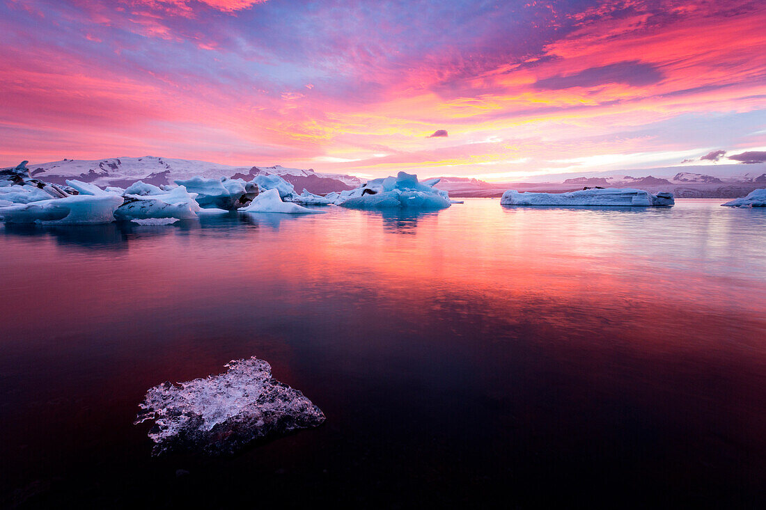 Icebergs and ice chunk at sunset, Jokulsarlon Glacier Lagoon, Iceland