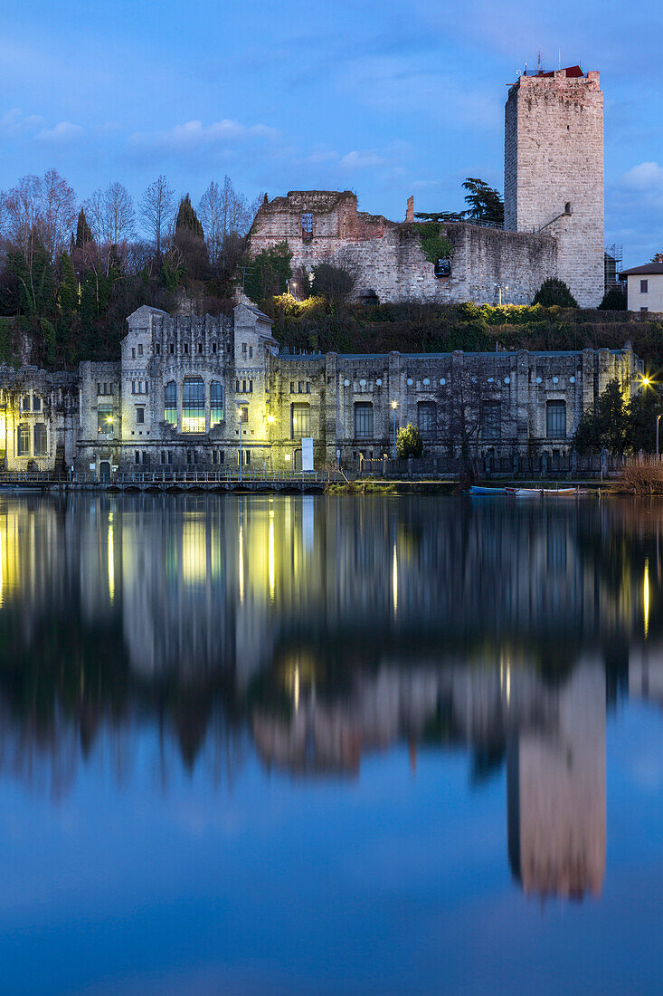 View of the Castello Visconteo and Centrale Idroelettrica Taccani on the shores of river Adda. Trezzo sull'Adda, Milan, Lombardy, Italy.