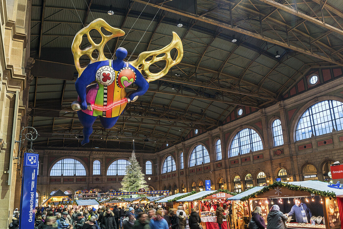Christmas market Zurich main station, guardian angel by Niki de St. Phalle, Zurich, Switzerland