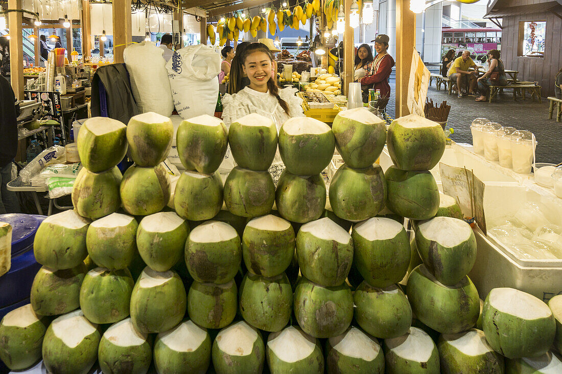 Street food market, coconuts , MBK shopping center, Bangkok, Thailand
