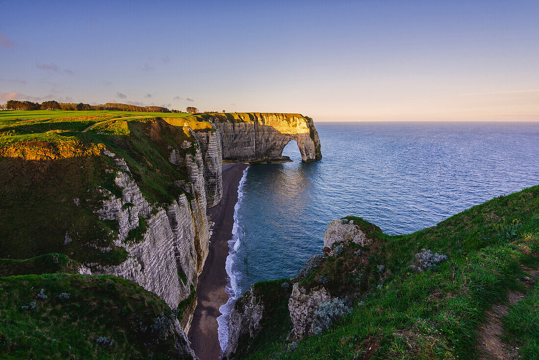 Arch in Etretat at sunrise ,Normandy,France.