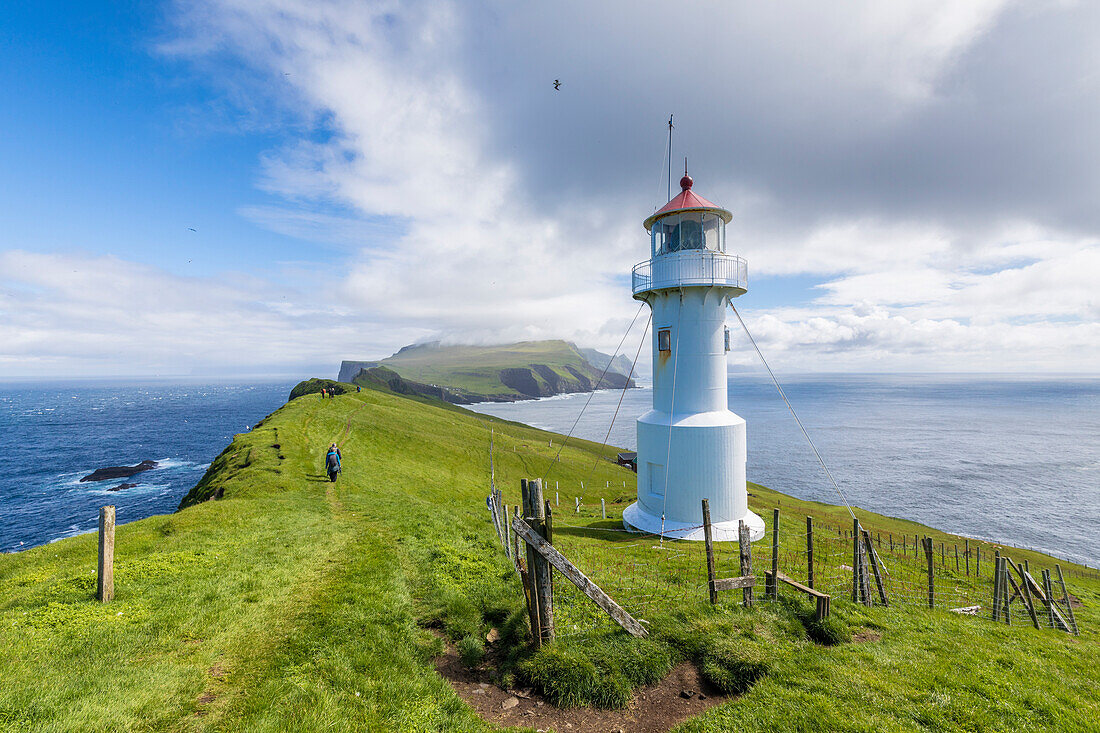 Lighthouse on islet known as Mykines Holmur, Mykines island, Faroe Islands, Denmark