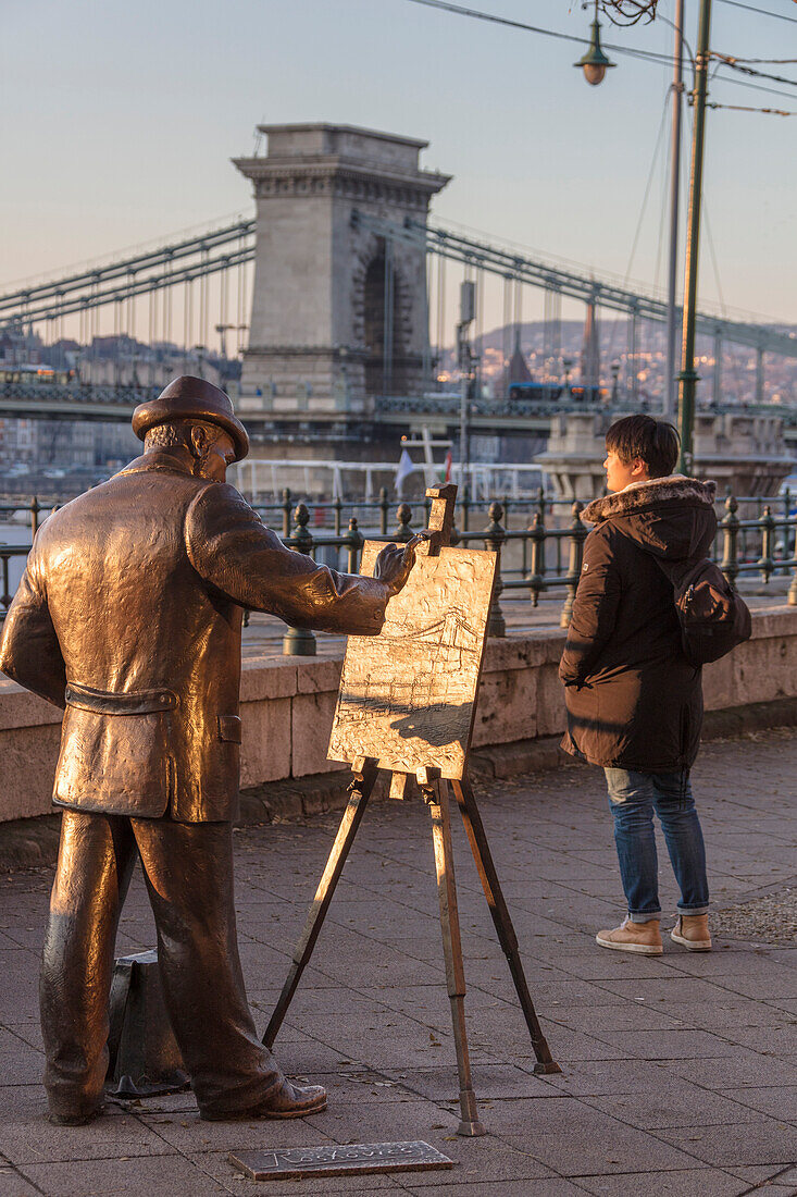 Tourist looks to the iconic Chain Bridge, Budapest, Hungary