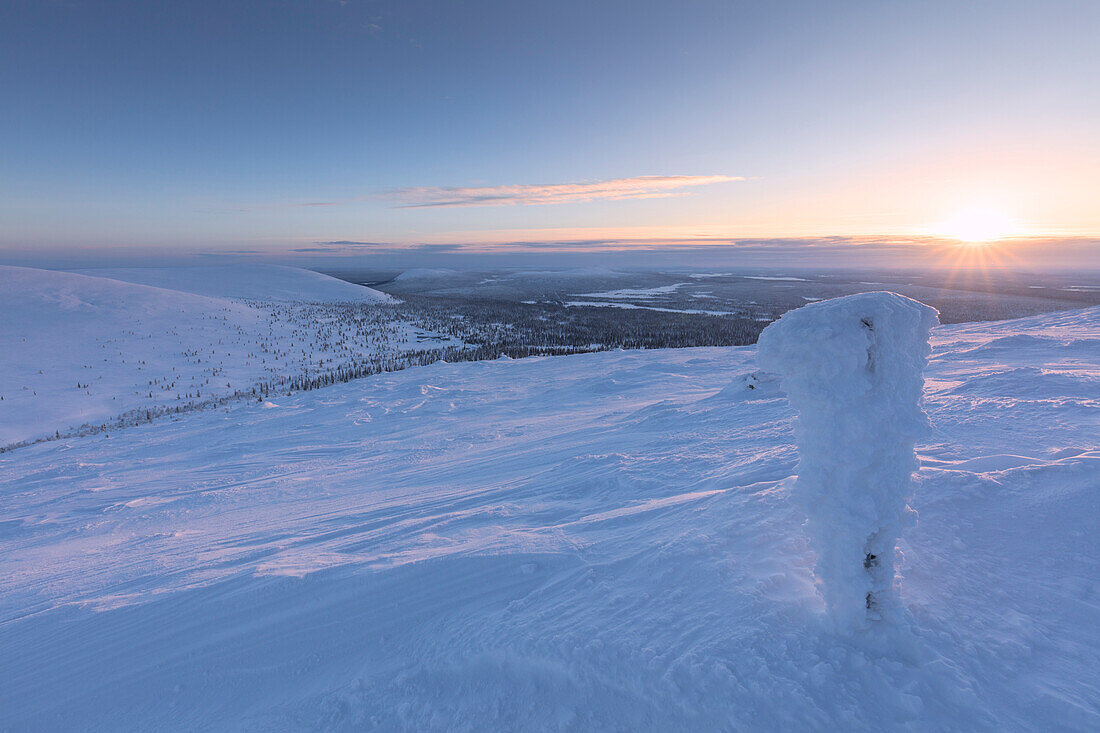 Sunrise on the frozen landscape covered with snow, Pallas-Yllastunturi National Park, Muonio, Lapland, Finland
