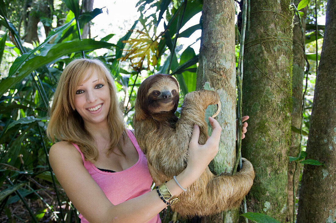 Brown-throated Three-toed Sloth (Bradypus variegatus) biologist, Rebecca Cliffe, holding sloth, Aviarios Sloth Sanctuary, Costa Rica