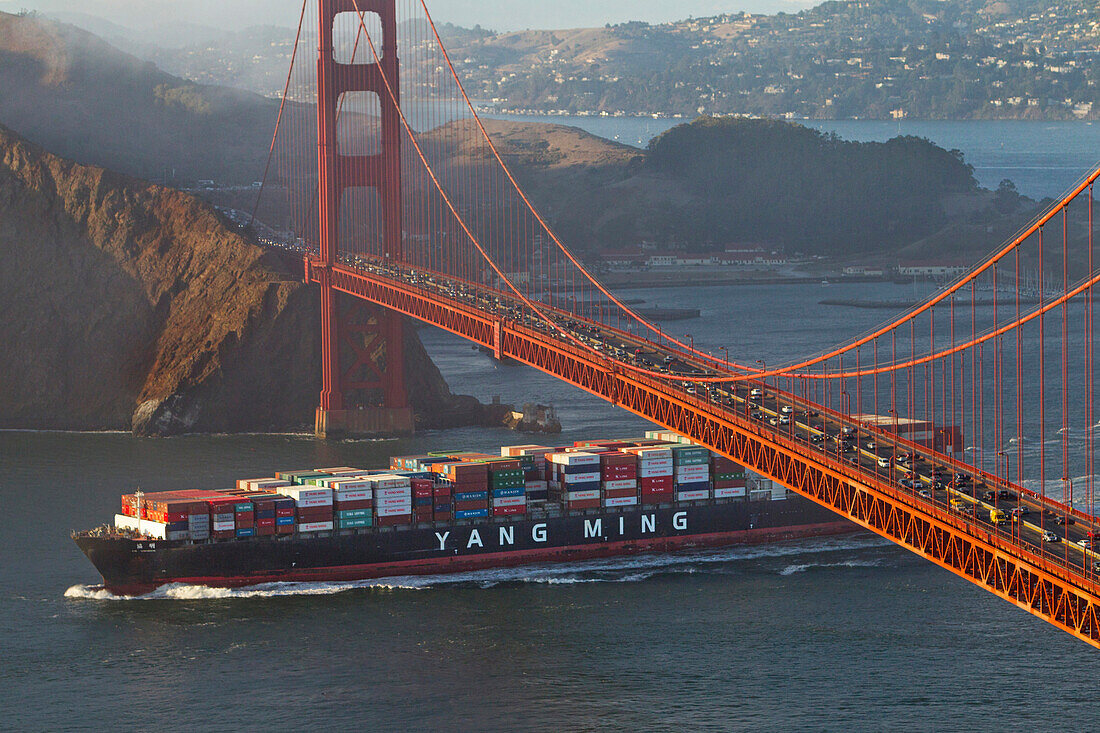 Freighter sailing under Golden Gate Bridge in San Francisco Bay, San Francisco, California, USA