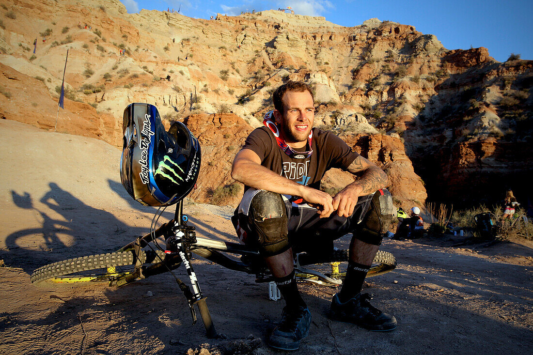 Mountain Biker at Red Bull Rampage sitting at sunset, Utah, USA