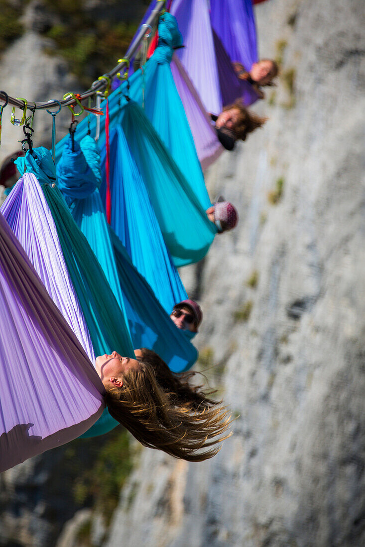 Side view of people lying in hammocks above mountains, Tijesno Canyon, Banja Luka, Bosnia and Herzegovina