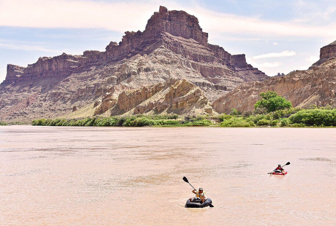 Two adventurous women rafting in river in Canyonlands National Park, Moab, Utah, USA
