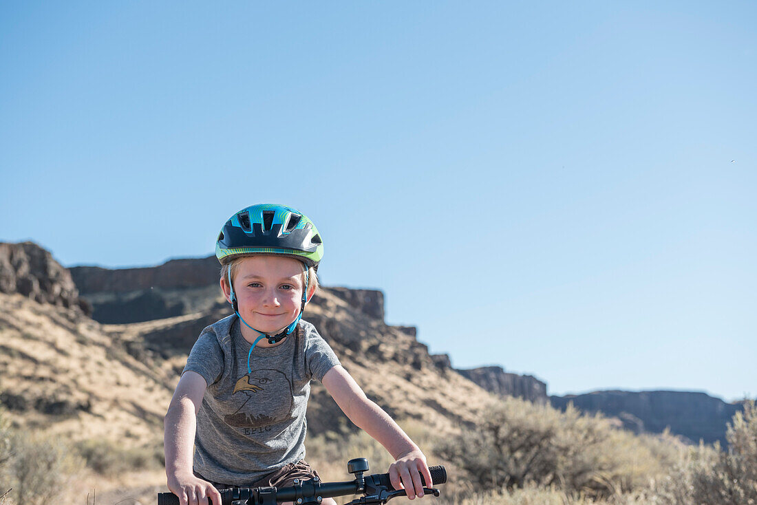 A young boy on a bike at Frenchmans Coulee, WA.
