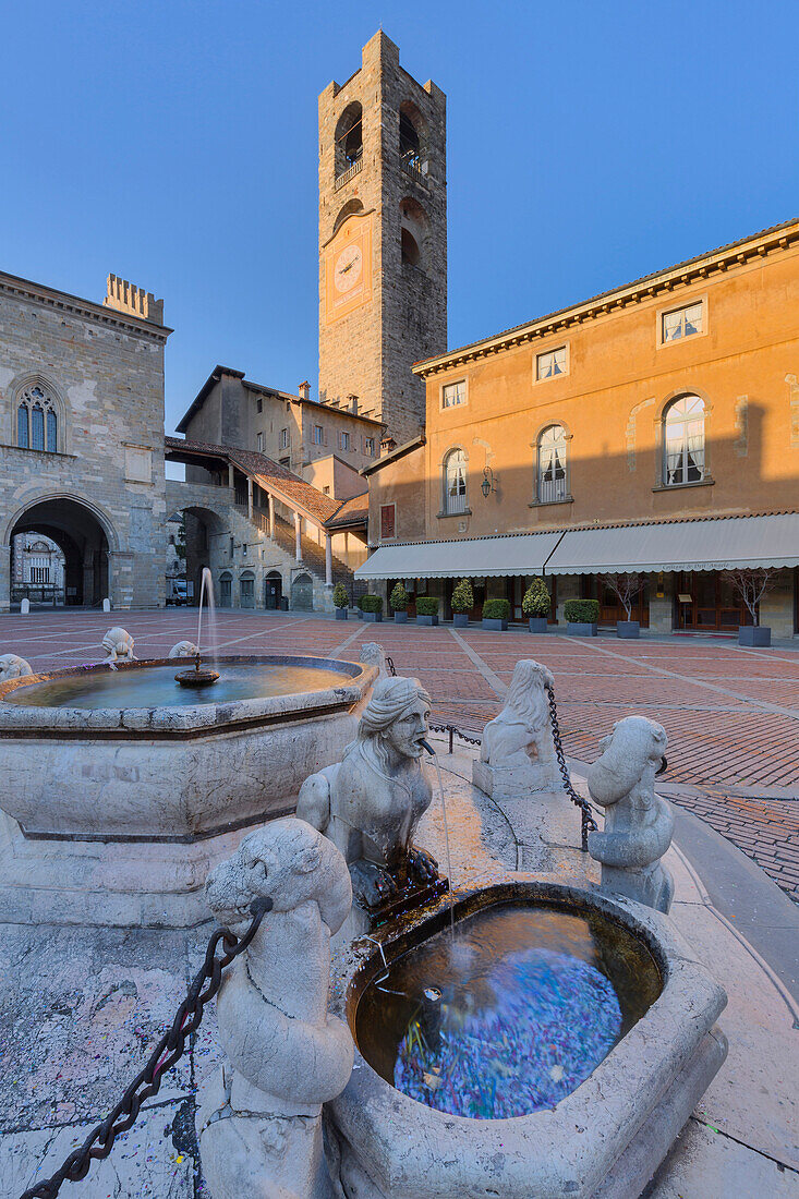 Piazza Vecchia with civic tower and Fontana del Contarini. Bergamo(Upper Town), Lombardy, Italy.