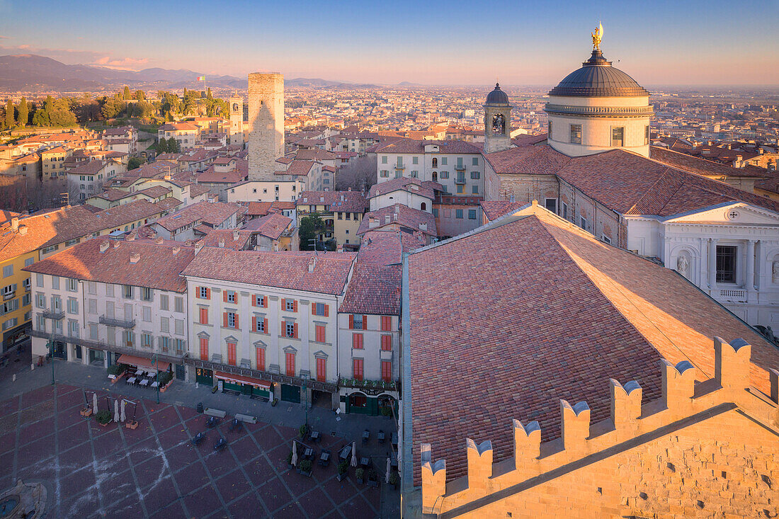 Piazza Vecchia and Bergamo Cathedral from above during sunset. Bergamo, Lombardy, Italy.