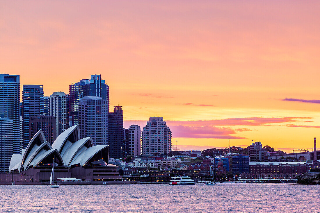 Sydney skyline and Opera House at sunset. New South Whales, Australia