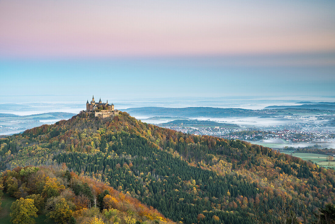Hohenzollern castle in autumnal scenery at dawn. Hechingen, Baden-Württemberg, Germany.