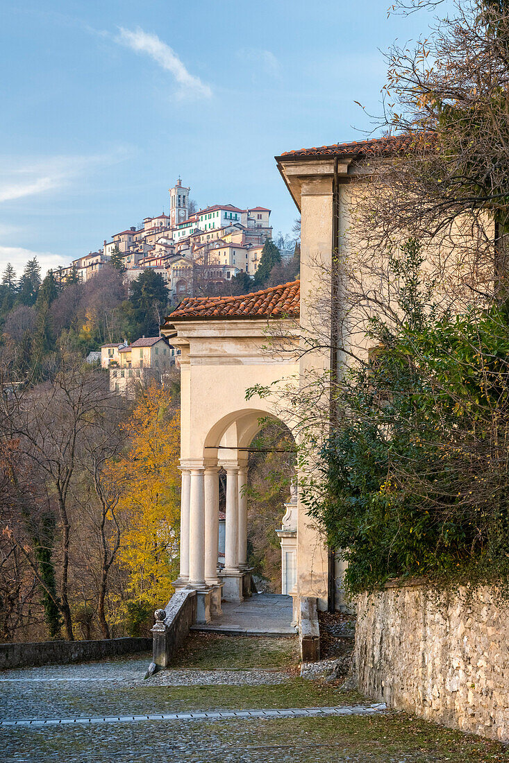 View of Santa Maria del Monte and one of the chapels of the sacred way. Sacro Monte di Varese, Varese, Lombardy, Italy.