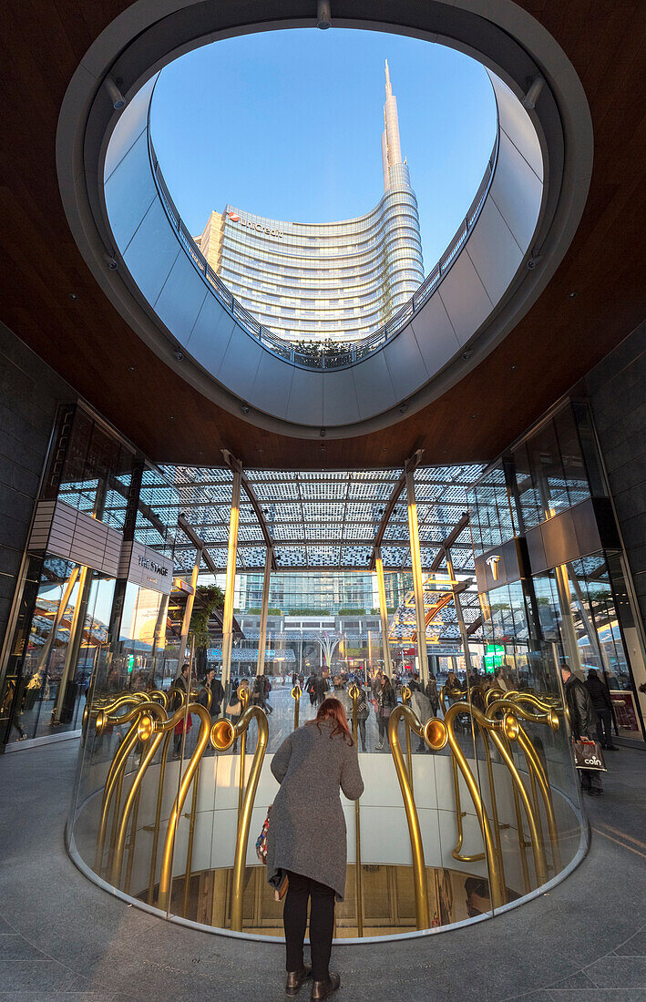 View of the Unicredit Tower spire and the artistic horns statue from Gae Aulenti square. Milan, Lombardy, Italy.