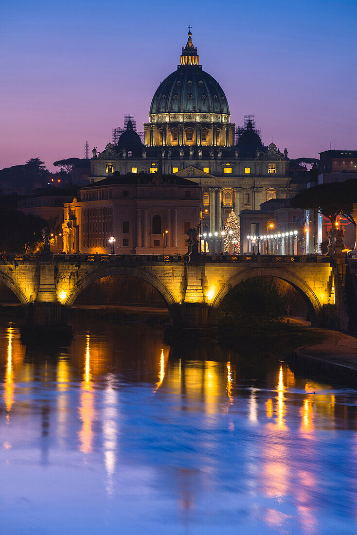 Rome, Lazio, Italy. Sunset on Tevere River, with Saint Peter Cathedral on the background.