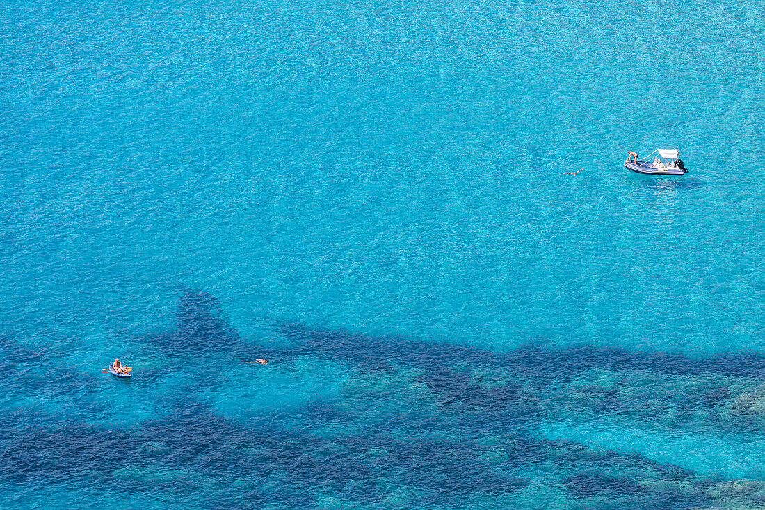 Bathers in the clear sea close to Menasina beach (plage de Menasina), Cargese, Corsica, France